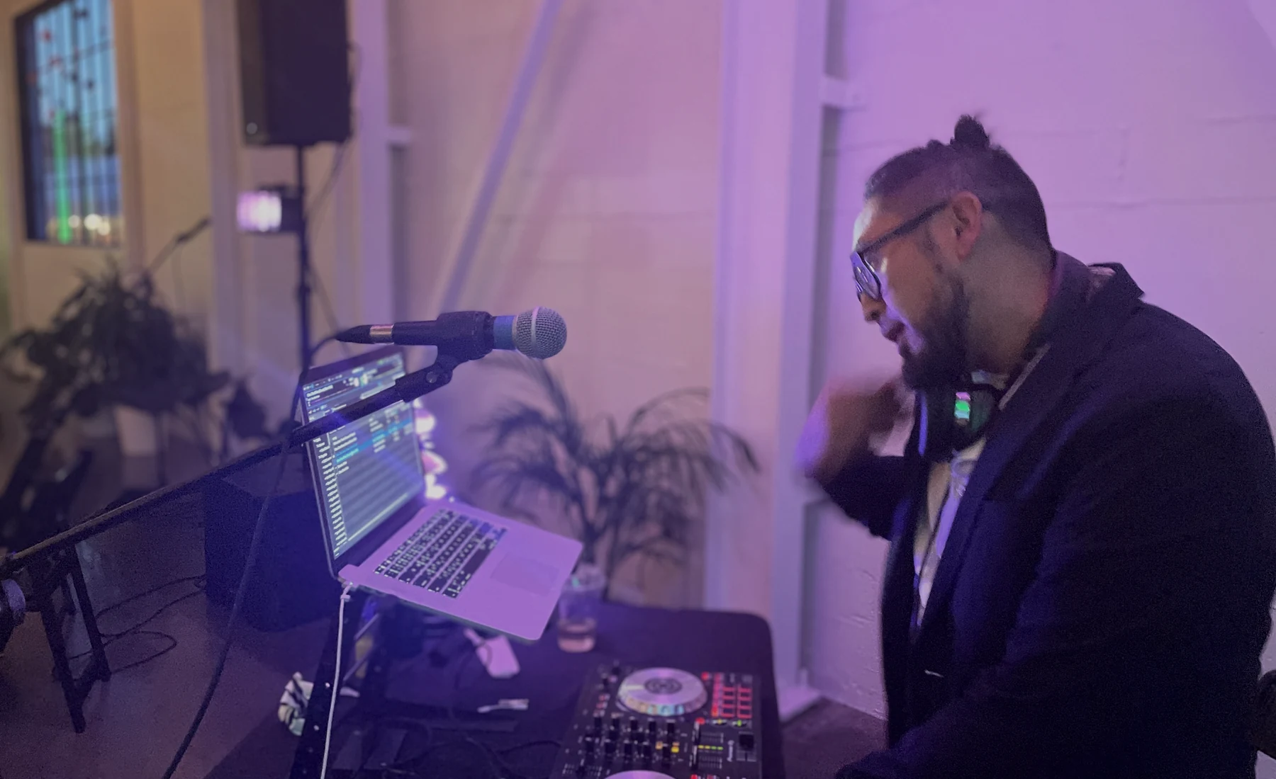 DJ working a reception with professional equipment